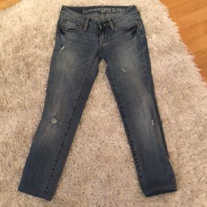 Low rise medium wash ripped jeans PETITE